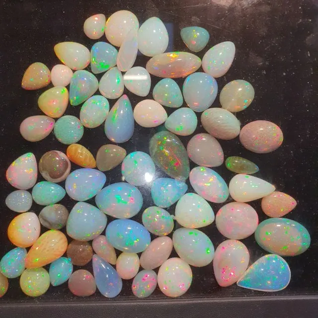 Polished Ethiopian Welo opal cabochons with rainbow play-of-color